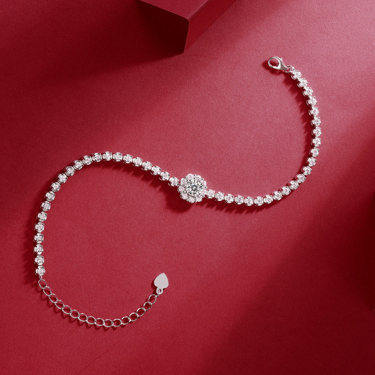 Pearl bracelet with a clasp on a red background
